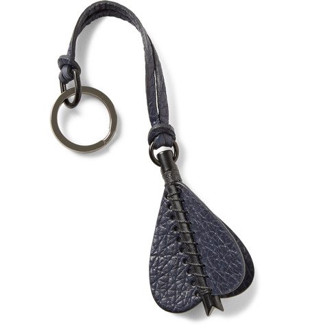 Grey-black keychain with matt patinated surface, metal arrow